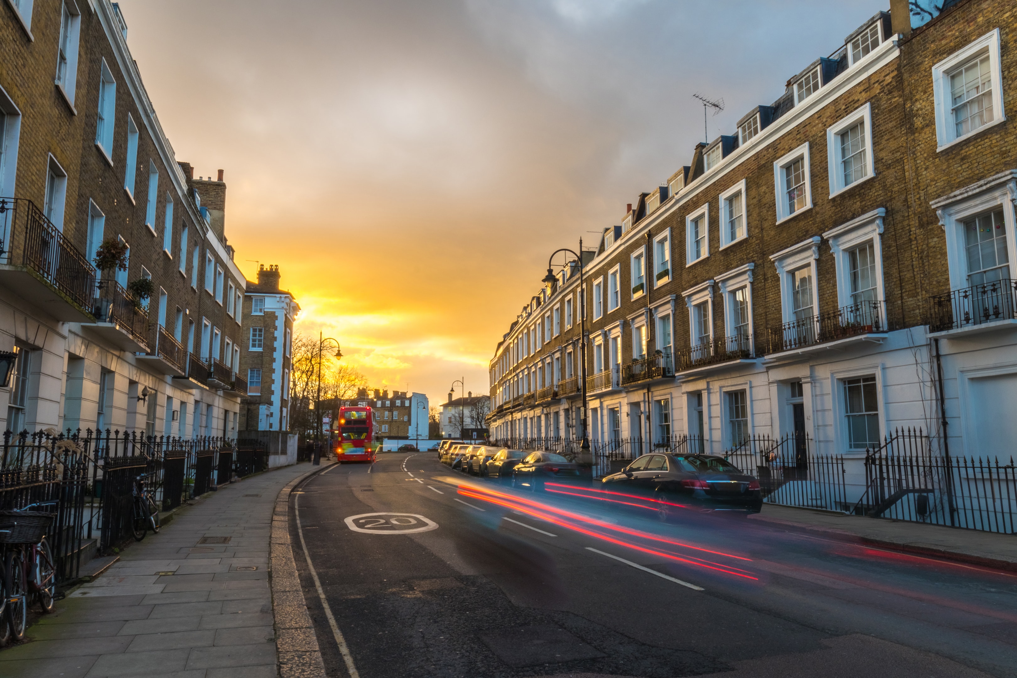 Cars passing houses 